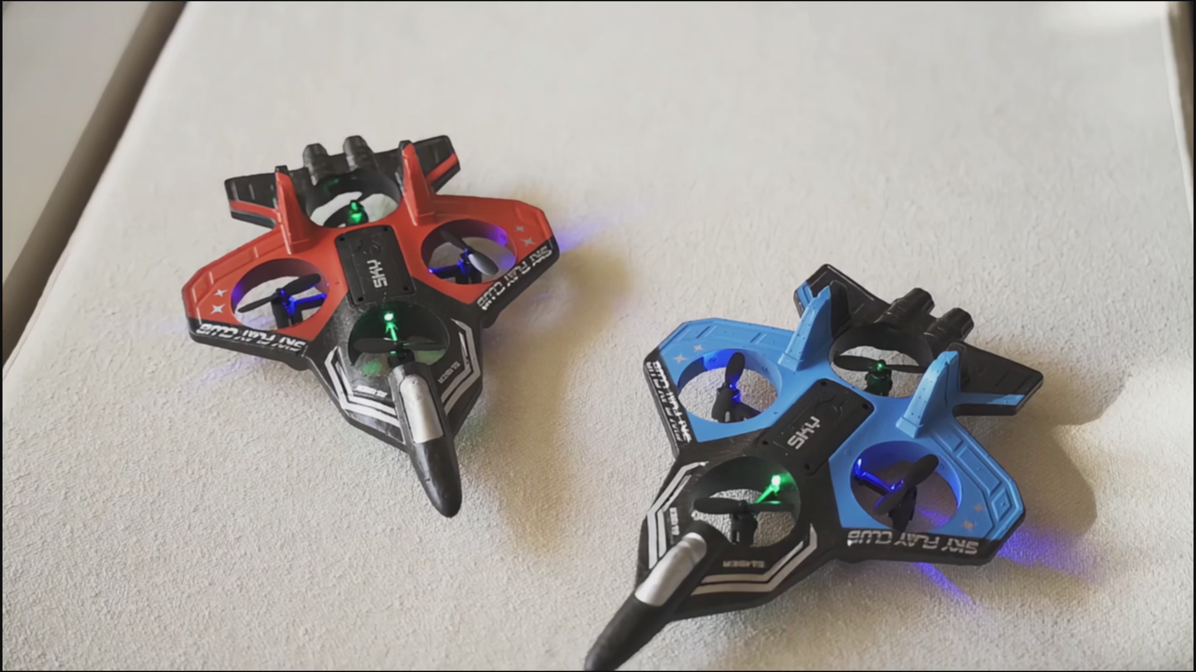 Load video: Close-up video of red and blue RC jet planes with LED lights, highlighting build quality, motors, and design details.